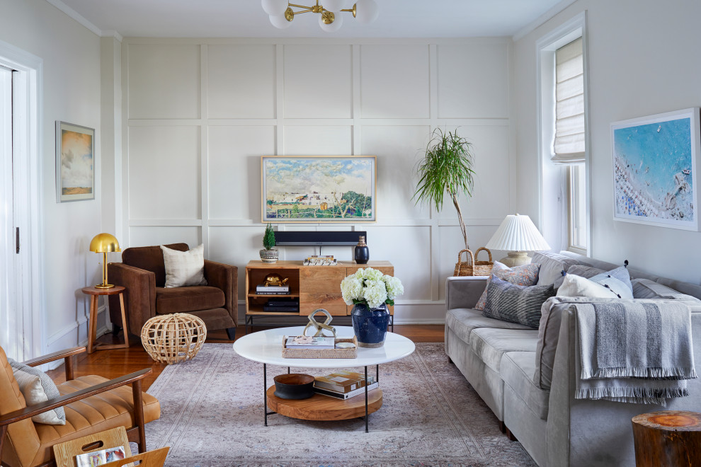 Mid-sized beach style living room in Philadelphia with panelled walls.