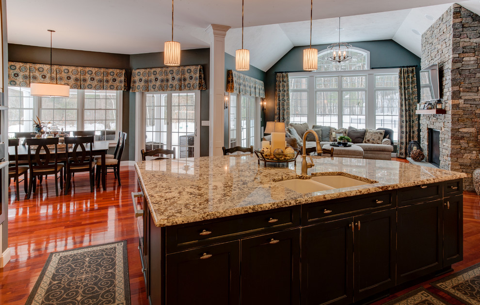 Open concept kitchen - large transitional medium tone wood floor open concept kitchen idea in Boston with a double-bowl sink, recessed-panel cabinets, white cabinets, granite countertops, multicolored backsplash, glass tile backsplash, paneled appliances and an island