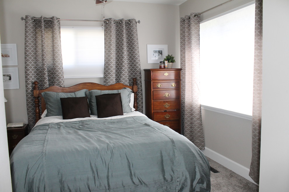 This is an example of a small transitional bedroom in Other with grey walls, carpet and no fireplace.