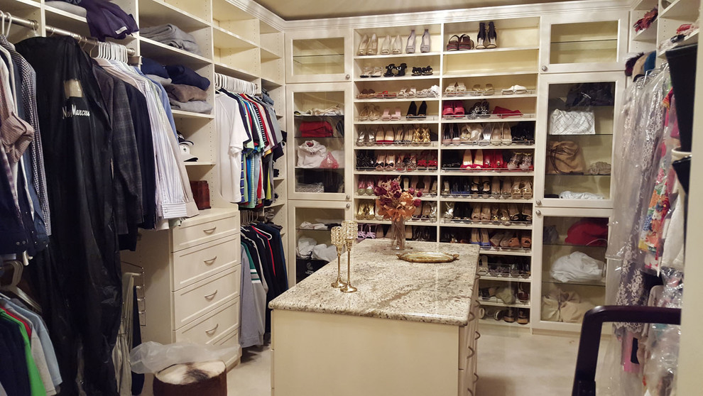 Photo of a large traditional gender-neutral walk-in wardrobe in Chicago with recessed-panel cabinets, white cabinets and ceramic floors.