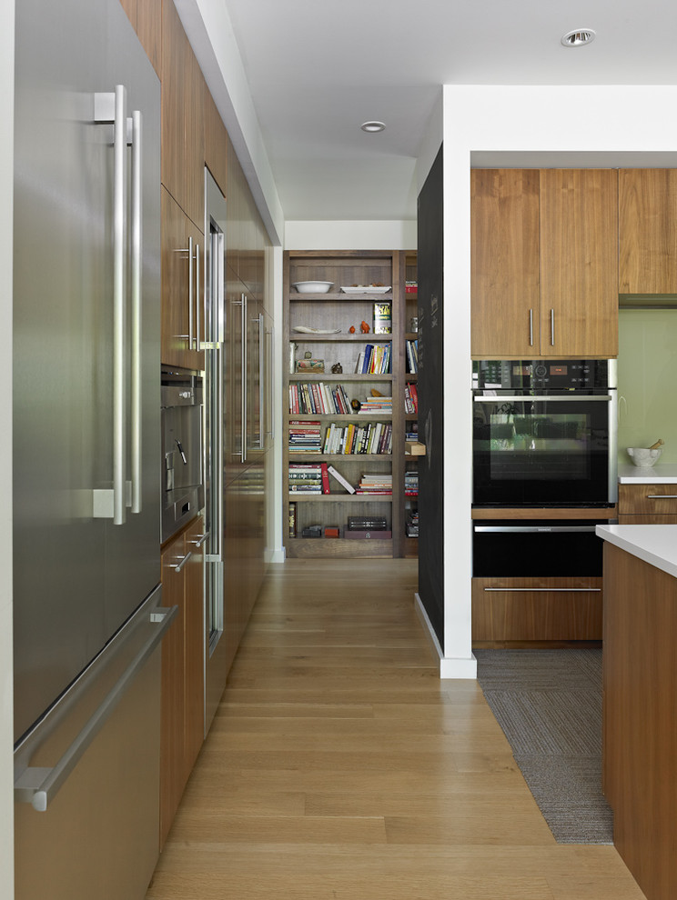 Photo of a large modern kitchen in Atlanta with flat-panel cabinets and with island.