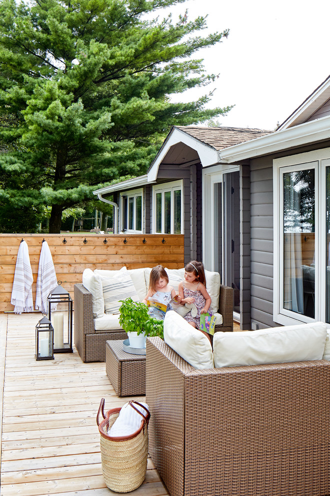 Inspiration for a mid-sized beach style backyard deck in Toronto with an outdoor shower and no cover.