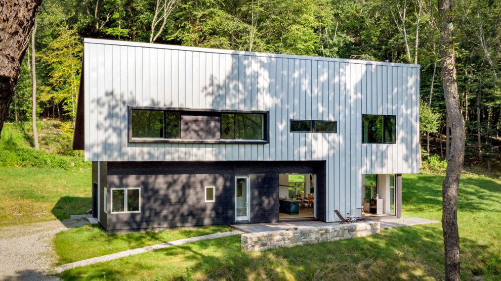 Inspiration for a large and white rustic two floor detached house in New York with metal cladding, a lean-to roof and a metal roof.