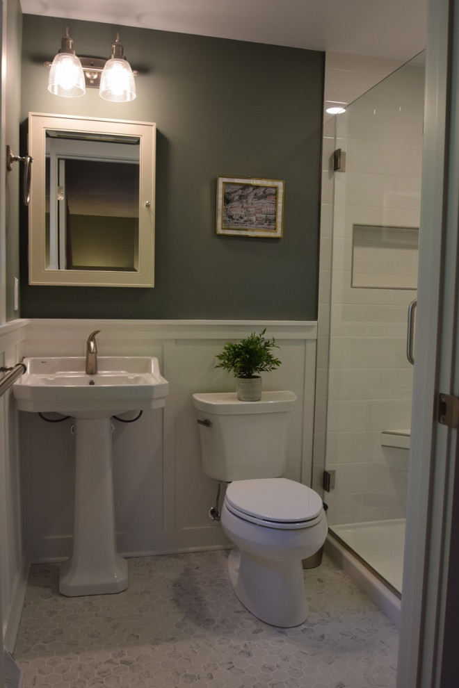 Photo of a small traditional 3/4 bathroom in Other with an alcove shower, a one-piece toilet, white tile, subway tile, green walls, ceramic floors, a pedestal sink, white floor, a hinged shower door, a shower seat, a single vanity and decorative wall panelling.
