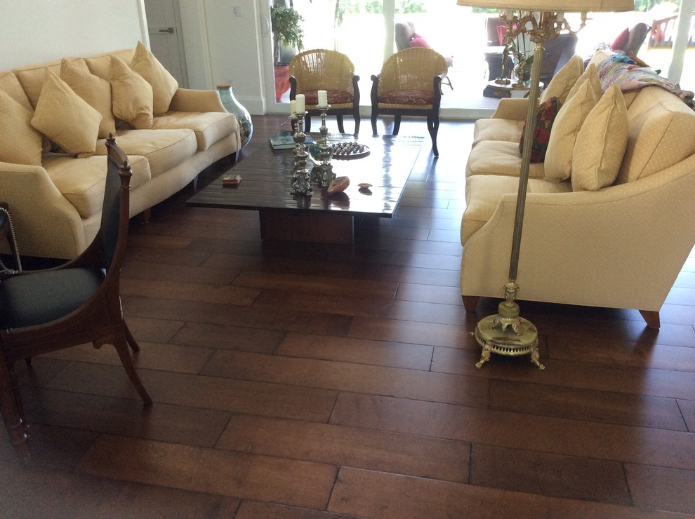 Inspiration for a traditional living room in Miami with medium hardwood floors.