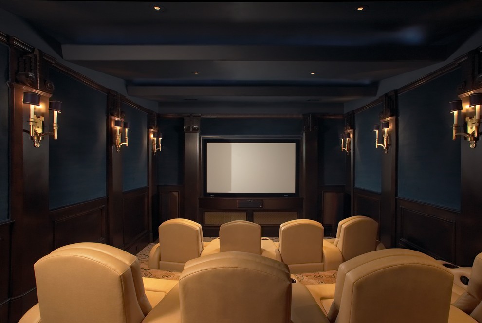 Large mediterranean enclosed home theatre in Houston with blue walls, carpet and a projector screen.