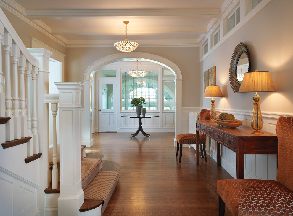 Design ideas for a traditional entryway in Boston with beige walls and dark hardwood floors.