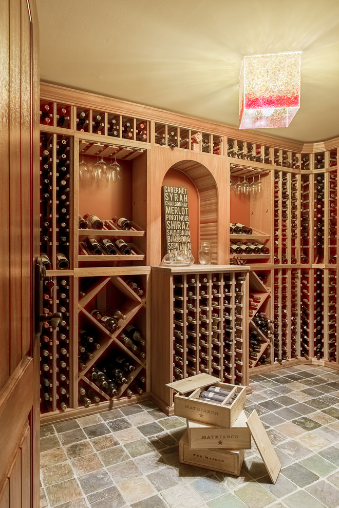 Inspiration for a small traditional wine cellar in New York with slate floors and display racks.