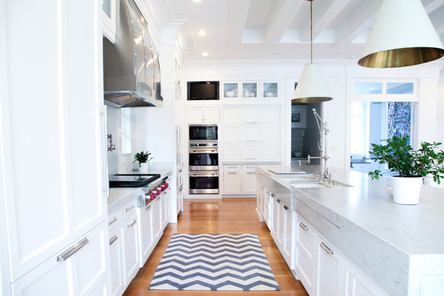 Light Bright Large Island With A Thick Marble Countertop