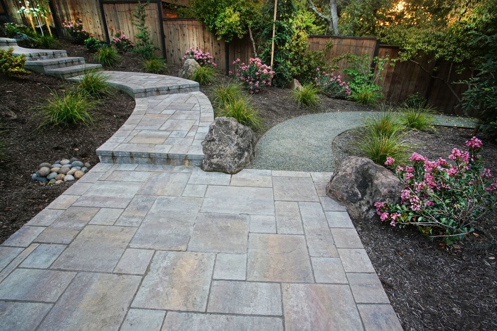 Design ideas for a mid-sized mediterranean backyard patio in San Francisco with concrete pavers and no cover.