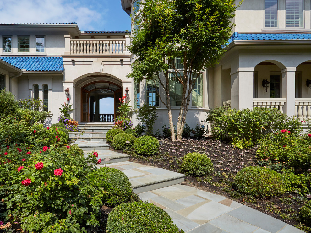 Inspiration for a huge mediterranean full sun front yard stone garden path in Chicago for summer.