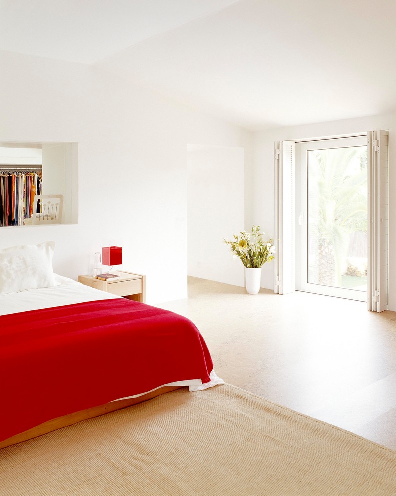 Photo of a mid-sized modern master bedroom in Other with white walls, no fireplace and beige floor.