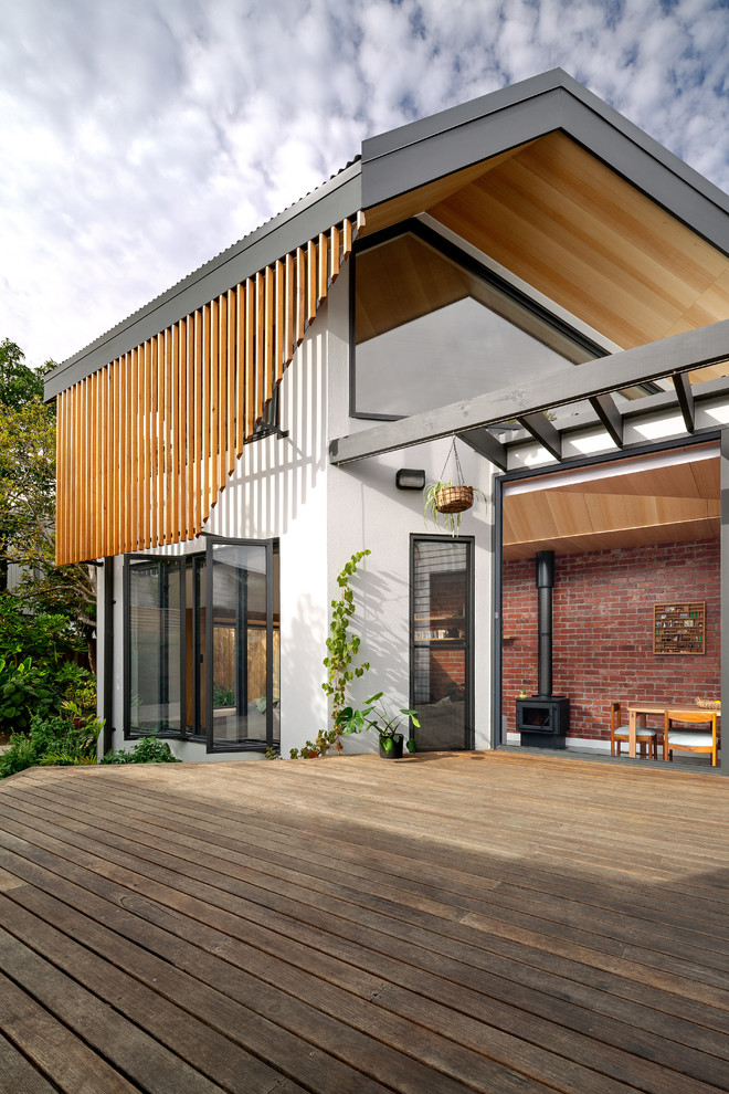This is an example of a contemporary backyard deck in Melbourne with no cover.