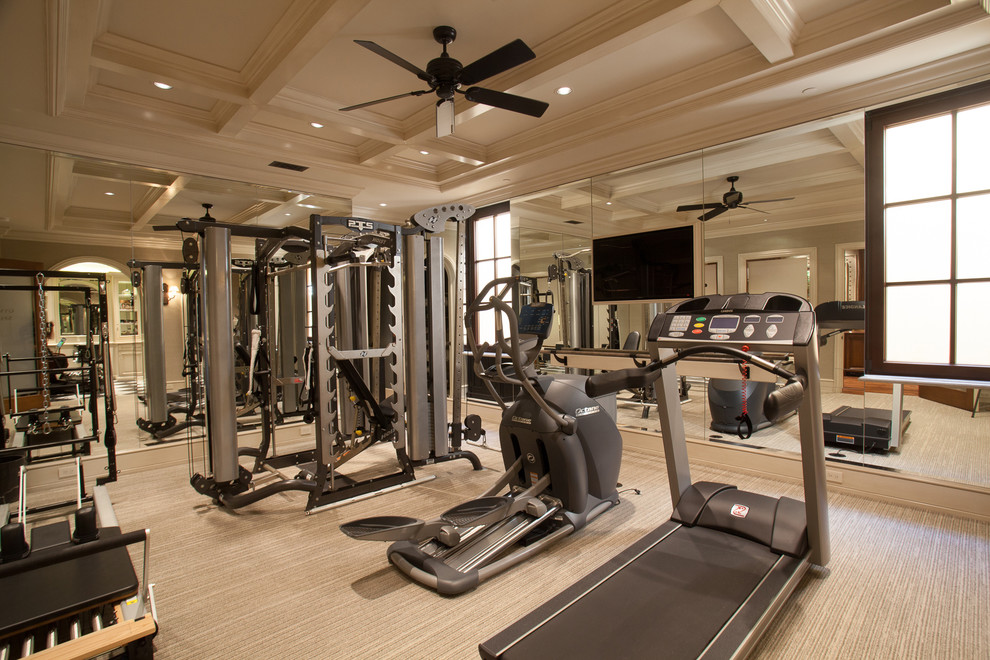 Photo of a mid-sized mediterranean home gym in Orange County with carpet and beige floor.