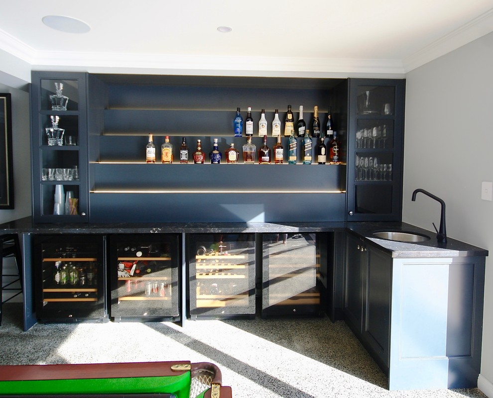 Mid-sized modern l-shaped wet bar in Sydney with recessed-panel cabinets, white cabinets, quartz benchtops, an undermount sink, blue splashback, concrete floors and grey floor.