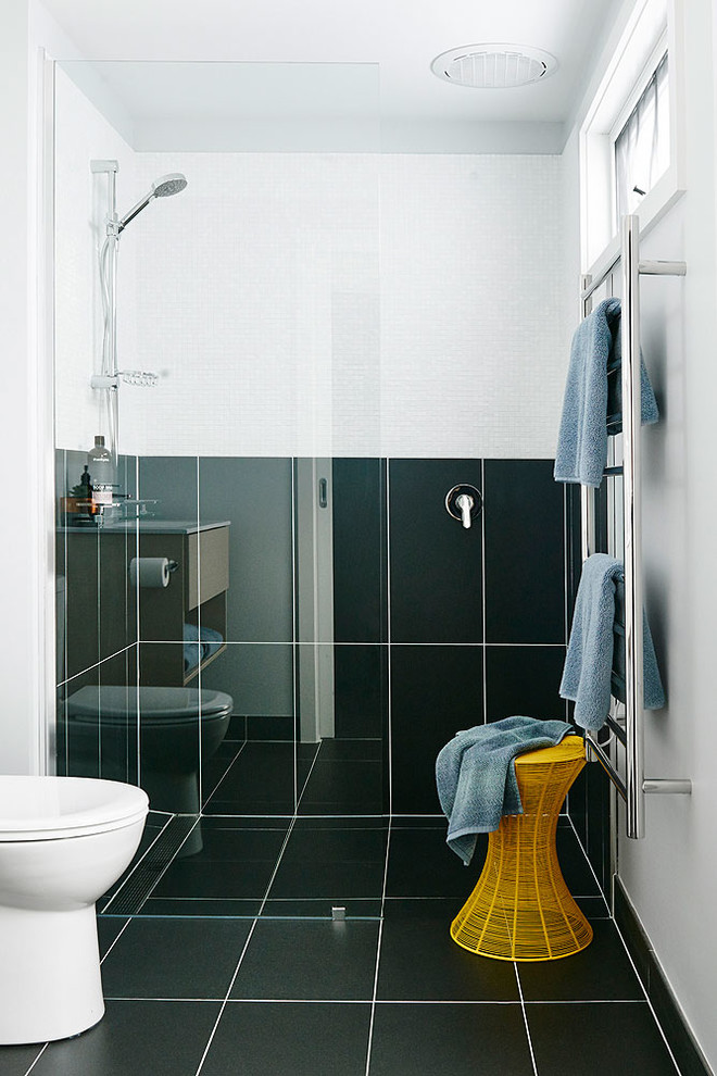 Inspiration for a large transitional 3/4 bathroom in Melbourne with recessed-panel cabinets, light wood cabinets, a curbless shower, a one-piece toilet, blue tile, cement tile, blue walls, ceramic floors, an integrated sink and limestone benchtops.