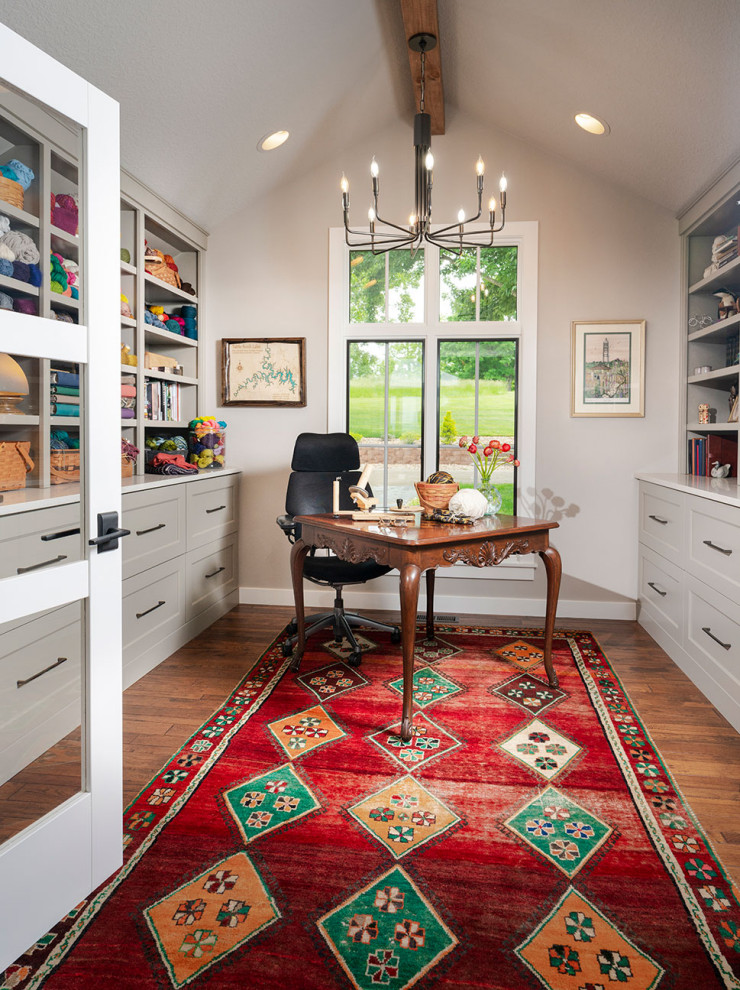 Medium sized classic craft room in Other with a freestanding desk.