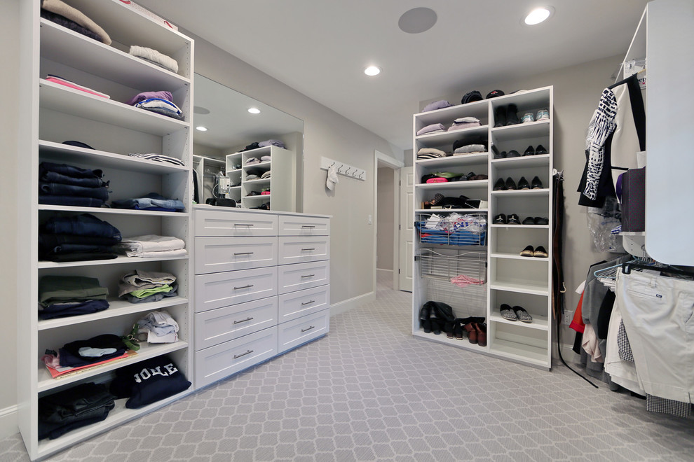 Inspiration for a transitional women's carpeted dressing room remodel in Boston with flat-panel cabinets and white cabinets