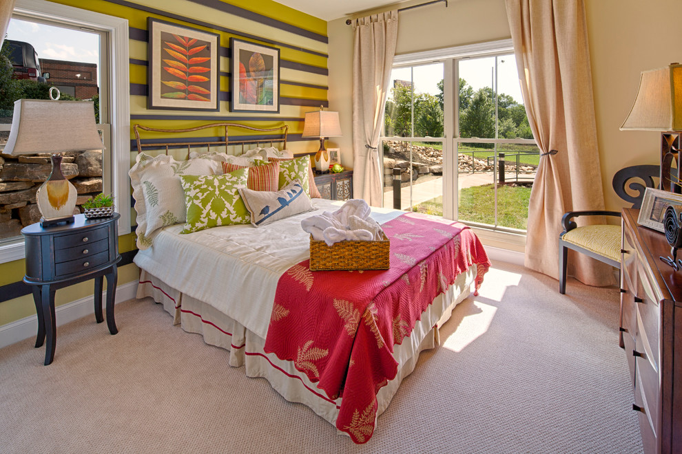 This is an example of a traditional bedroom in Cleveland with multi-coloured walls and carpet.