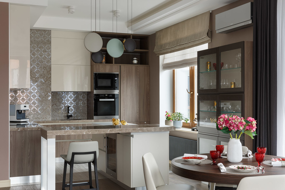 Design ideas for a contemporary l-shaped eat-in kitchen in Saint Petersburg with with island, flat-panel cabinets, beige cabinets, metallic splashback, metal splashback, black appliances, brown benchtop, dark hardwood floors and brown floor.