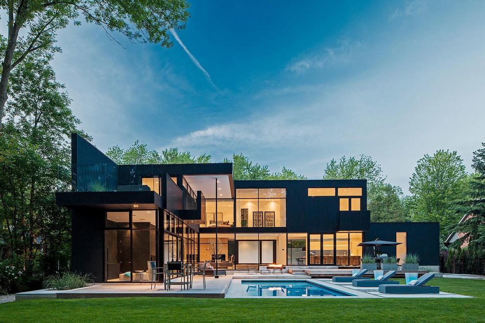 Inspiration for a large modern two-storey black exterior in Toronto.