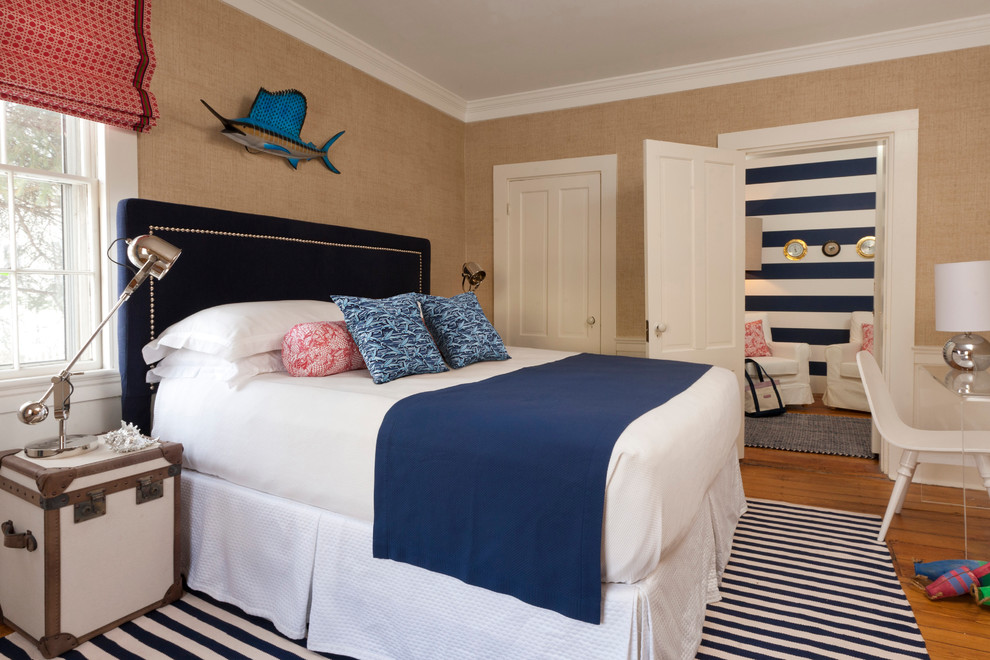 Inspiration for a beach style bedroom in Boston with beige walls, light hardwood floors and no fireplace.