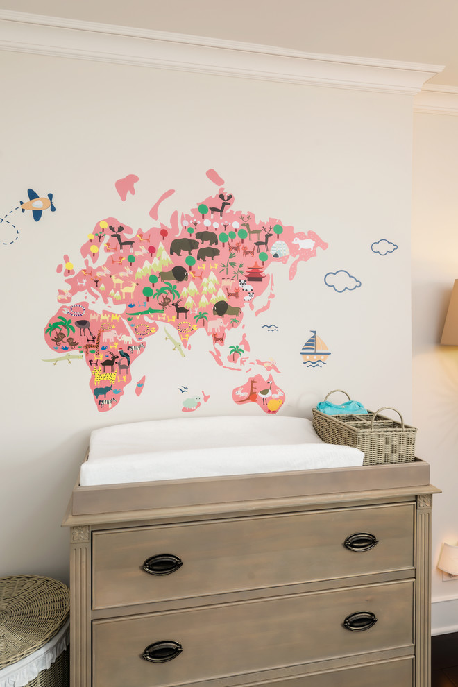 Inspiration for a mid-sized traditional nursery for girls in San Francisco with beige walls and dark hardwood floors.