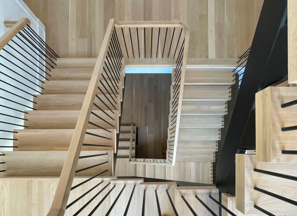 Example of a huge minimalist wooden floating mixed material railing and shiplap wall staircase design in DC Metro