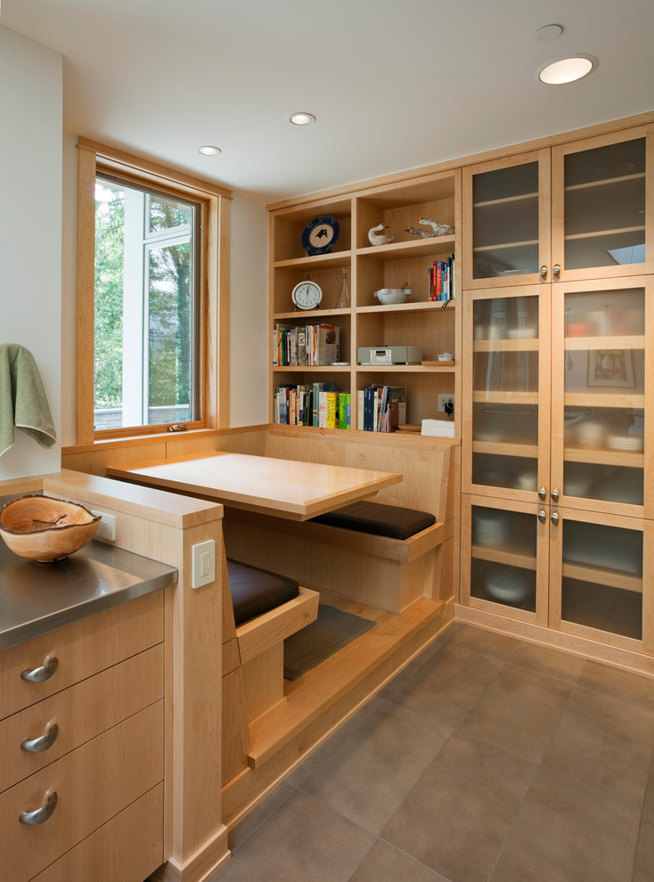 Contemporary galley eat-in kitchen in Seattle with flat-panel cabinets, light wood cabinets, stainless steel benchtops, porcelain floors and no island.