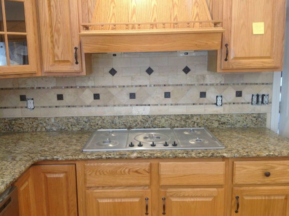 Inspiration for a mid-sized l-shaped open concept kitchen remodel with raised-panel cabinets, light wood cabinets, laminate countertops, beige backsplash, ceramic backsplash and stainless steel appliances