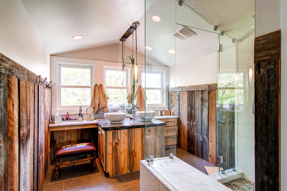 Inspiration for a large country master bathroom in Denver with a vessel sink, medium wood cabinets, solid surface benchtops, a corner shower, ceramic tile, white walls, ceramic floors, beige tile and shaker cabinets.