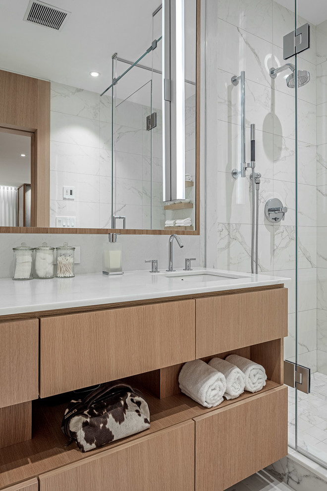 Inspiration for a mid-sized modern master white tile and marble tile marble floor bathroom remodel in Toronto with light wood cabinets, white walls, marble countertops, a hinged shower door and white countertops