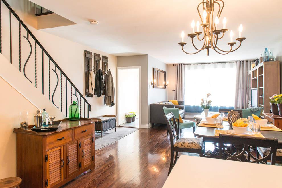 Example of a small transitional dark wood floor kitchen/dining room combo design with gray walls