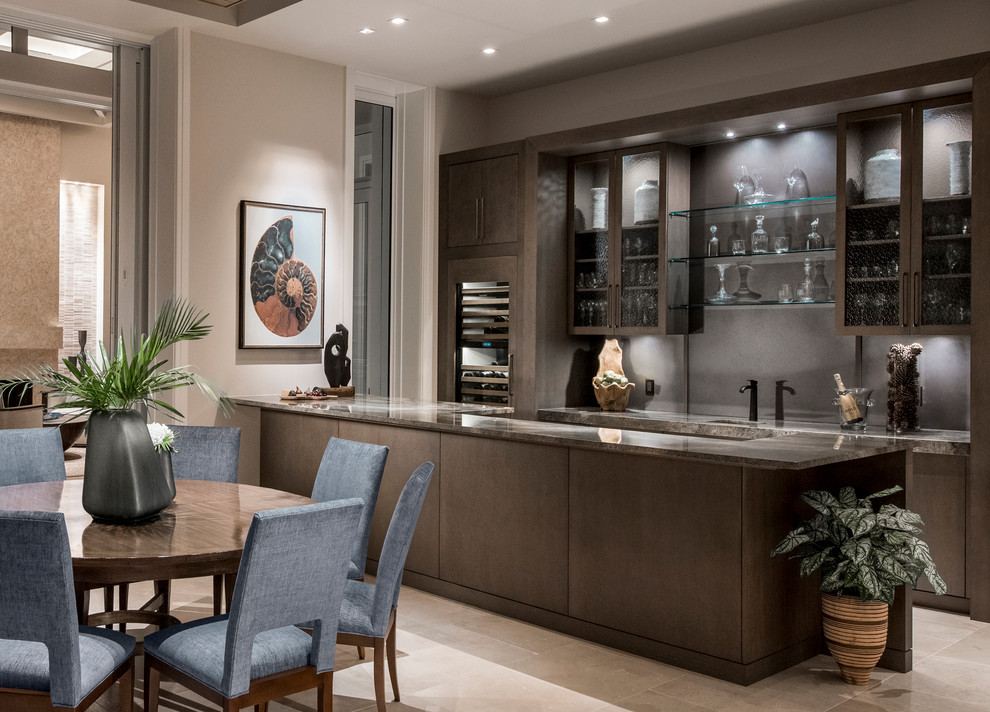 Photo of a mid-sized transitional galley seated home bar in Miami with flat-panel cabinets, brown cabinets, granite benchtops, grey splashback and stone slab splashback.