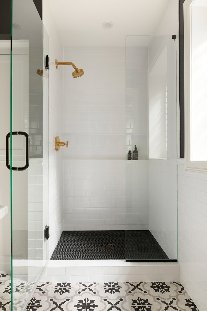 Photo of a mid-sized transitional 3/4 bathroom in Minneapolis with shaker cabinets, white cabinets, an alcove shower, white tile, ceramic tile, grey walls, porcelain floors, an undermount sink, marble benchtops, grey floor, a hinged shower door and white benchtops.