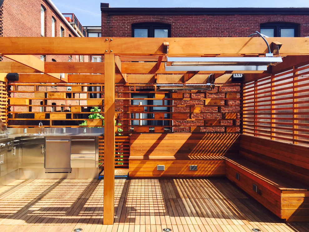 Small contemporary rooftop and rooftop deck in DC Metro with an outdoor kitchen and a pergola.
