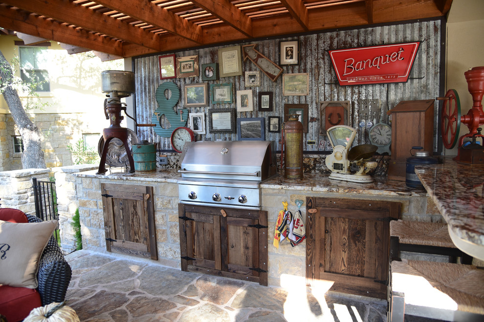 Inspiration for a mid-sized traditional backyard patio in Austin with an outdoor kitchen, concrete slab and a pergola.