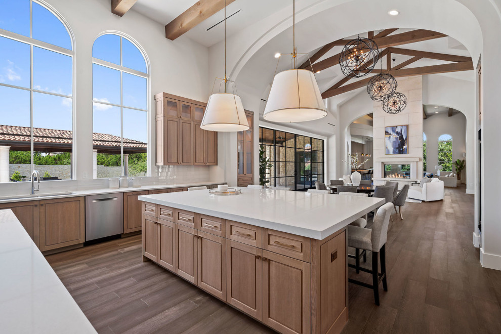 Inspiration for an expansive transitional kitchen in Austin with recessed-panel cabinets, light wood cabinets, quartzite benchtops, beige benchtop and exposed beam.