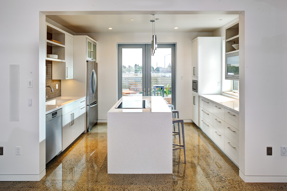 Inspiration for a mid-sized contemporary galley open plan kitchen in Sacramento with an undermount sink, flat-panel cabinets, white cabinets, quartz benchtops, grey splashback, glass tile splashback, stainless steel appliances, terrazzo floors, with island and beige floor.
