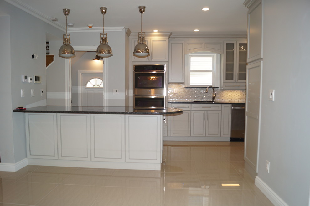 Example of a transitional kitchen design in New York