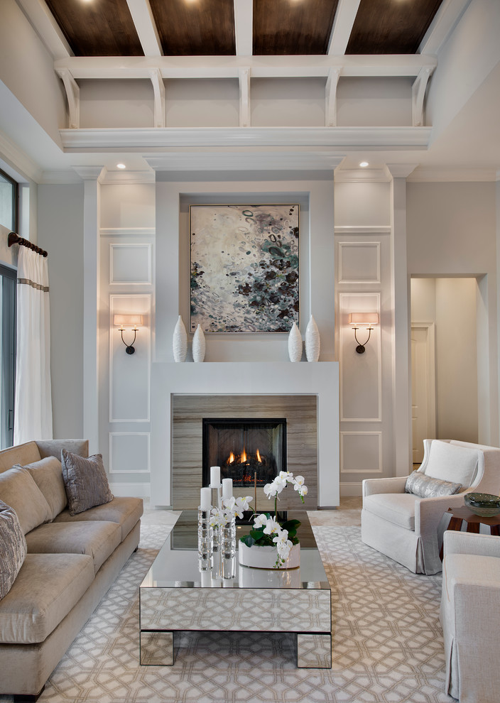 Photo of a transitional formal enclosed living room in Miami with grey walls and a standard fireplace.