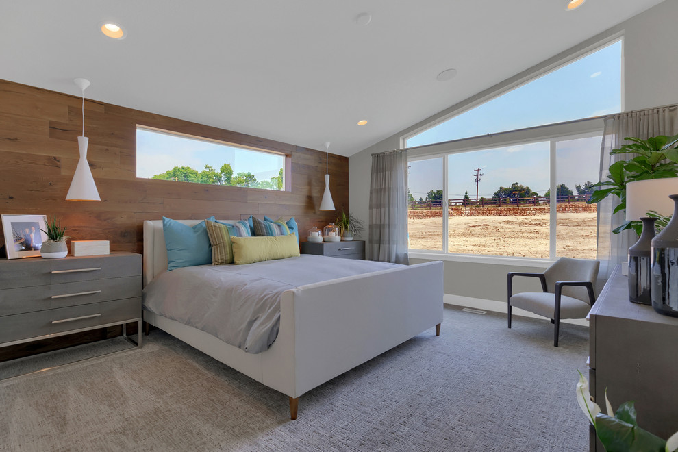 This is an example of a large contemporary master bedroom in Denver with beige walls, carpet and beige floor.