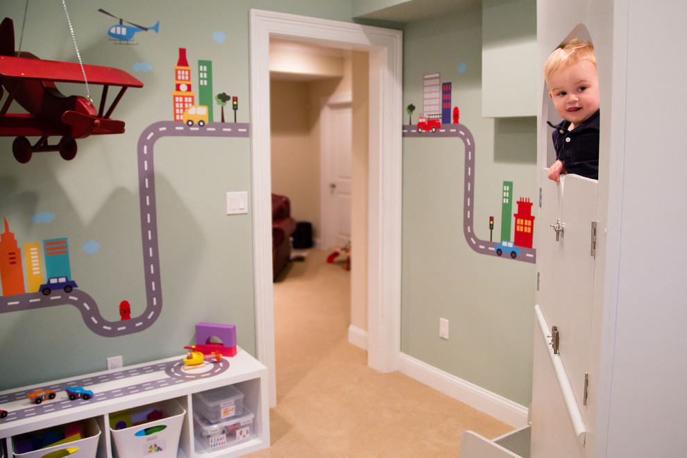 This is an example of a mid-sized modern gender-neutral kids' room in New York with grey walls and carpet.