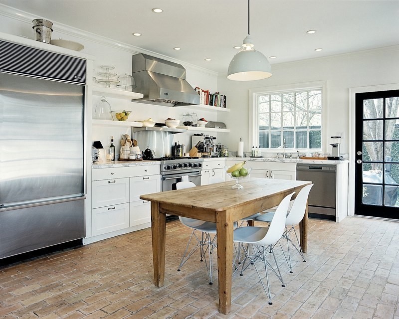 Inspiration for a kitchen in Other with brick floors.