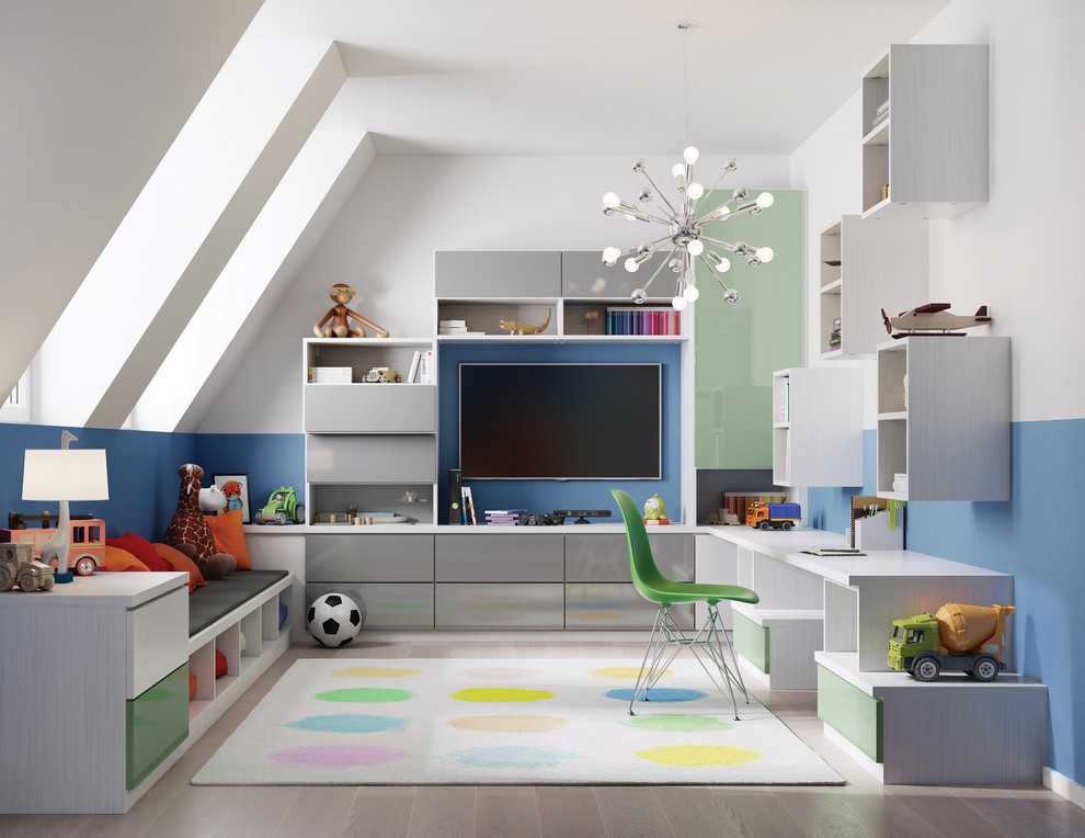 Photo of a mid-sized contemporary kids' playroom for kids 4-10 years old and boys in Los Angeles with multi-coloured walls and light hardwood floors.