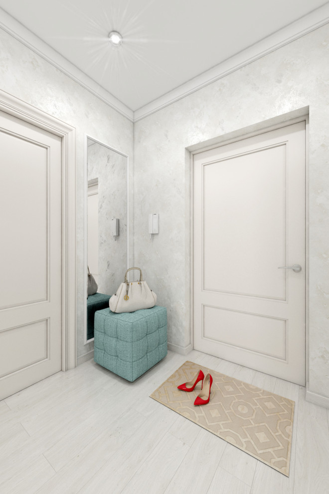 This is an example of a mid-sized transitional hallway in Other with white walls, laminate floors, white floor, recessed and wallpaper.
