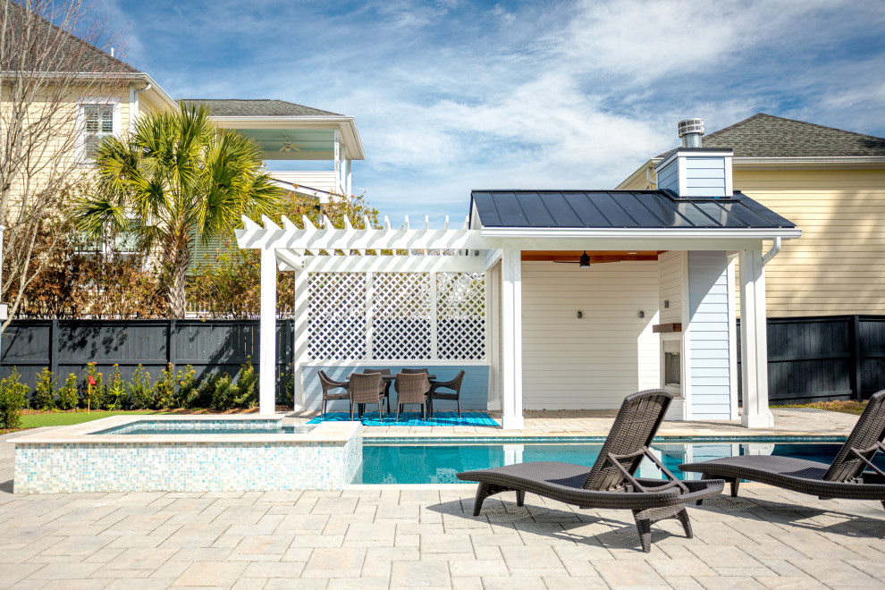 Mid-sized trendy backyard concrete paver and rectangular pool photo in Charleston
