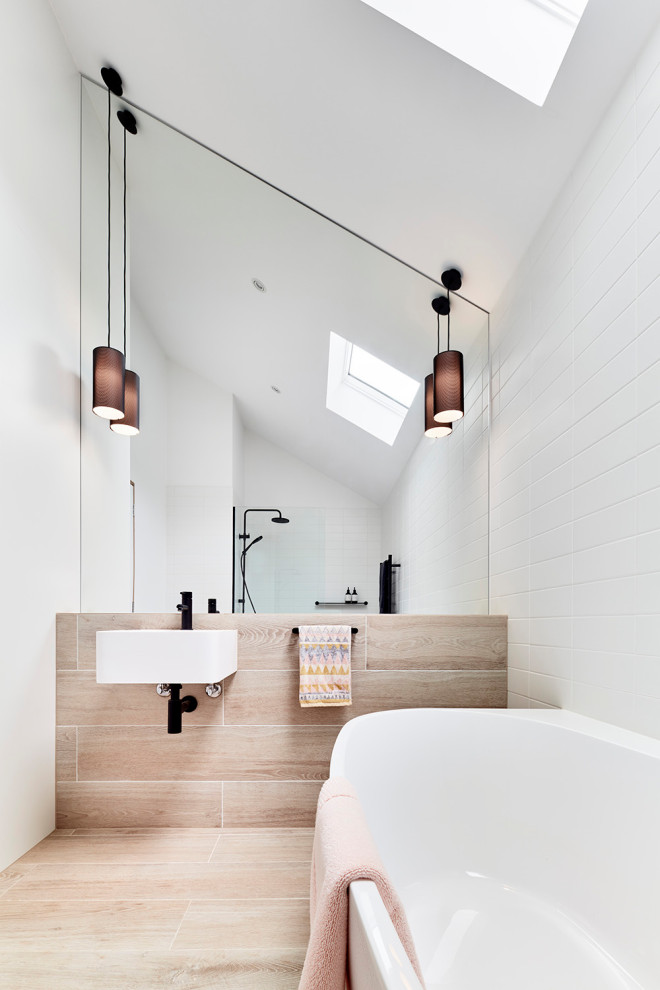 Photo of a mid-sized contemporary master bathroom in Melbourne with white cabinets, beige tile, stone tile, cement tiles, a wall-mount sink, beige floor, an open shower, a single vanity and white walls.