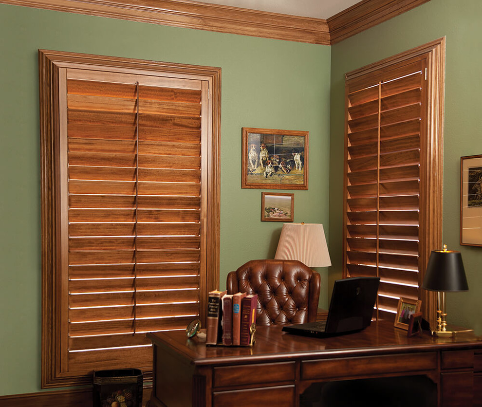 Inspiration for a mid-sized timeless freestanding desk dark wood floor and brown floor study room remodel in Orange County with green walls and no fireplace