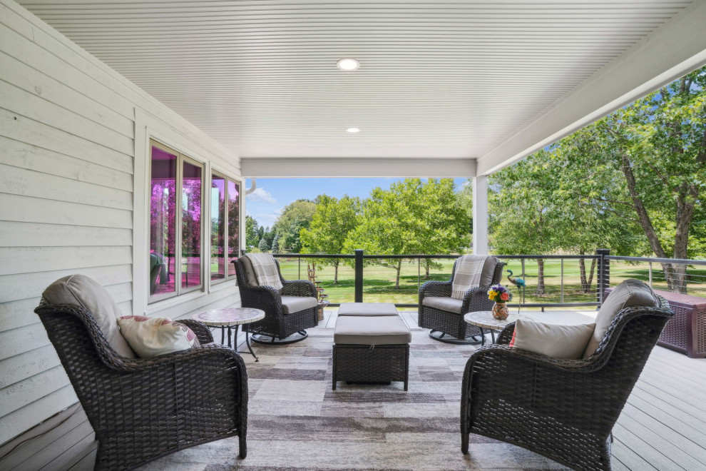 Inspiration for a mid-sized transitional backyard second story cable railing deck remodel in Columbus with a roof extension
